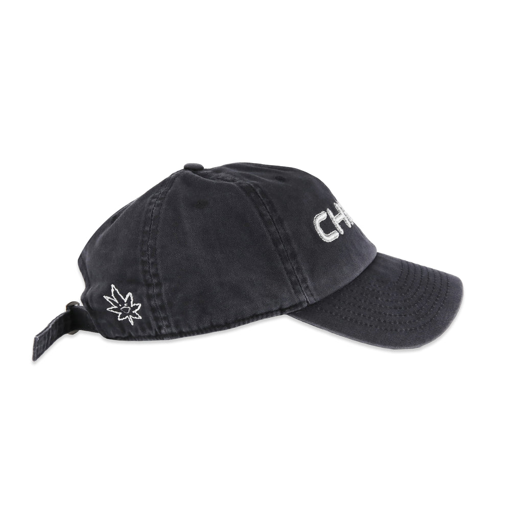 Side view of washed grey Metro Bloomin Chrome hat with silver signature Metro Bloomin leaf embroidery.