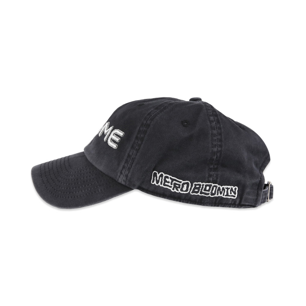 Side view of washed grey Metro Bloomin Chrome hat with silver Metro Bloomin wordmark embroidery.